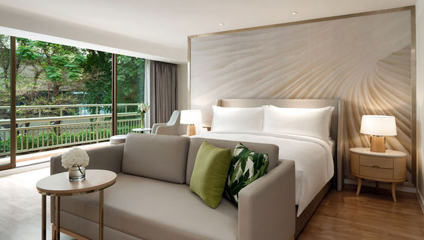 A deluxe suite bedroom at the Movenpick BDMS Wellness Resort Bangkok.