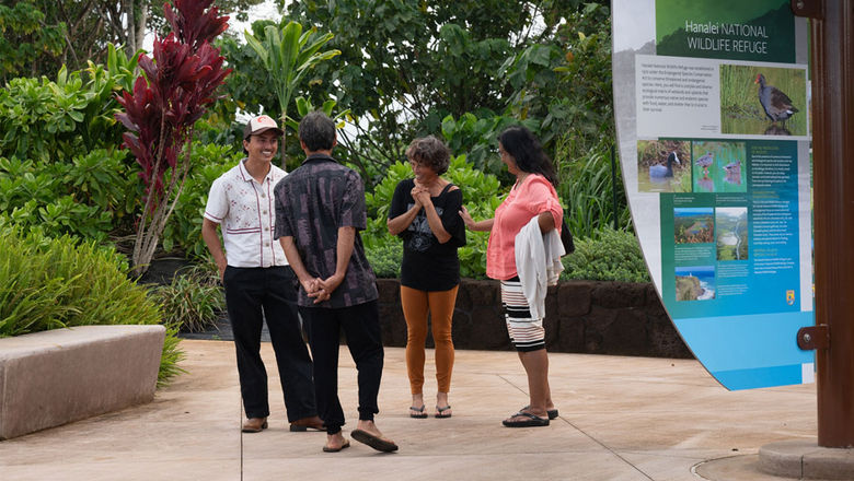 Visitors chat during the opening ceremont at the Hanalei National Wildlife Refuge Viewpoint.