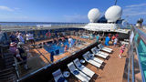 A view of the pool deck of Atlas Ocean Voyages’ World Traveller as the Venetian tea dance party began.