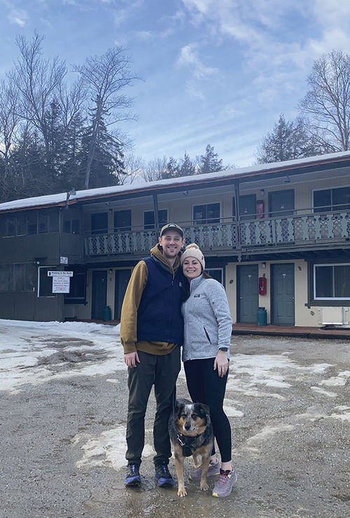 Brett and Casey McManus in front of the rundown Killington motel that they purchased in early 2024, which they've since renovated and relaunched as the Après Inn