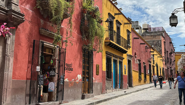 Colorfully painted homes and shops flank the cobblestone streets that wind throughout San Miguel de Allende.