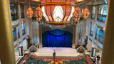 The atrium on the Disney Treasure features ornate lighting inspired by the movie "Aladdin."