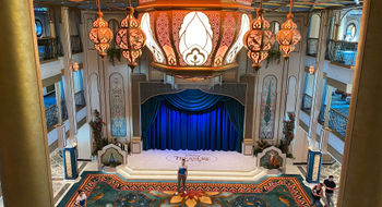 The atrium on the Disney Treasure features ornate lighting inspired by the movie "Aladdin."