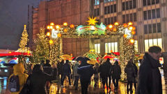 A Christmas market entryway in Cologne, Germany, next to the city's famous cathedral.