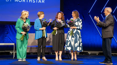 After Vacation Planners president Jenn Lee, second from right, was named godmother of AmaWaterways' AmaSintra, other AmaWaterways godmothers took the stage. From left, Cruise Planners' Michelle Fee, Jackie Friedman of Nexion and Debbie Fiorino of Dream Vacations and Cruise One. Alex Pinelo of AmaWaterways is at the right.