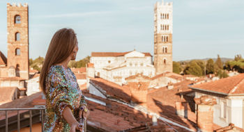 A solo guest takes in a terrace view at the Grand Universe Lucca in Tuscany. In response to a large percentage of solo travelers in Italy, it launched an offer called Solo & Spritzing.