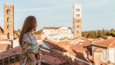 A solo guest takes in a terrace view at the Grand Universe Lucca in Tuscany. In response to a large percentage of solo travelers in Italy, it launched an offer called Solo & Spritzing.