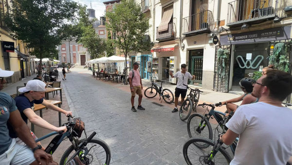 Pausing for a bit of local history on an e-bike tour in Madrid.