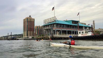 The pier in Yonkers, N.Y., with a kayaker bearing the initials for the Yonkers Paddling and Rowing Club on their life vest. Could this city, just up the Hudson River from Manhattan, one day host a river cruise ship?