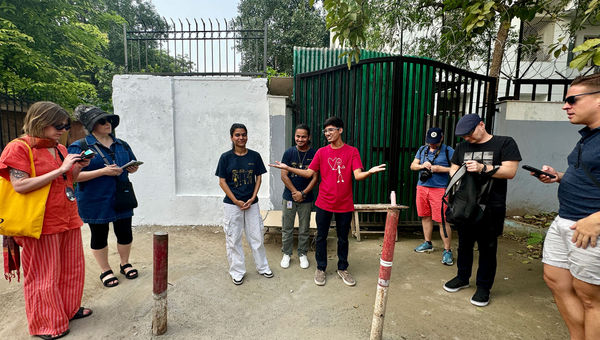 Salaam Baalak Trust tour guides, in the middle, from left, Kadjal, Jafar and Salman.