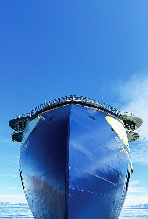 The bow of the National Geographic Resolution as seen from the waterline.