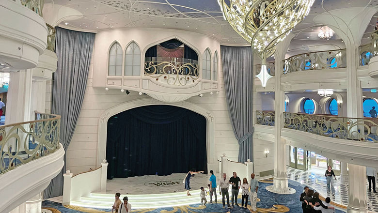 The Grand Hall on the Disney Wish has a stage for performances and character appearances.