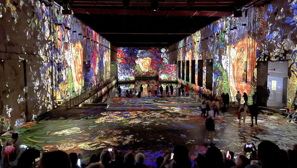 Van Gogh's self portrait illuminated and reflected in submarine holding pens at Bordeaux's Bassin des Lumieres.